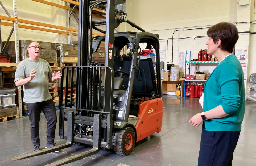 Nikki and local business owner in warehouse